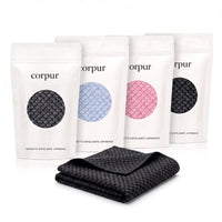 Lot de 4 serviettes de douche exfoliantes Corpur (noire, bleue, rose, noire) et une serviette visage
